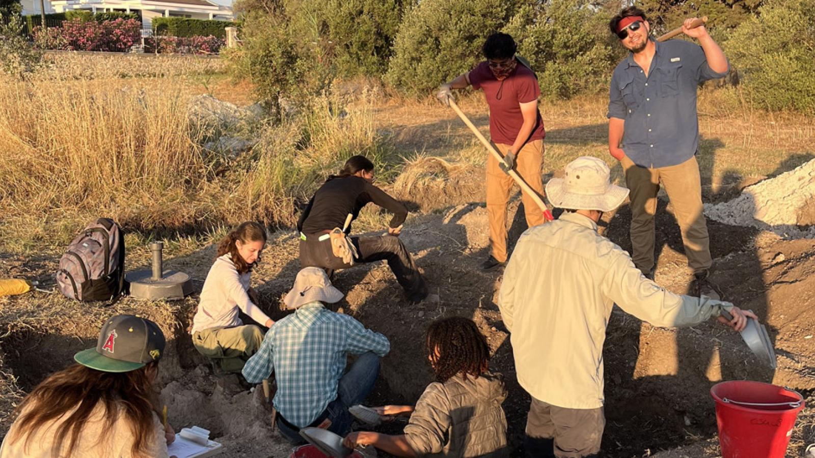 students at a dig site