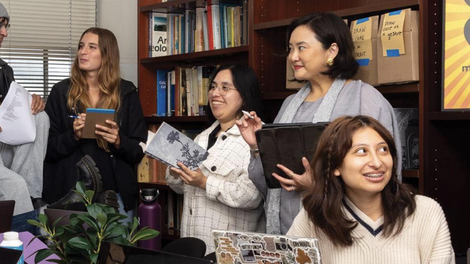 students gathered around a table working
