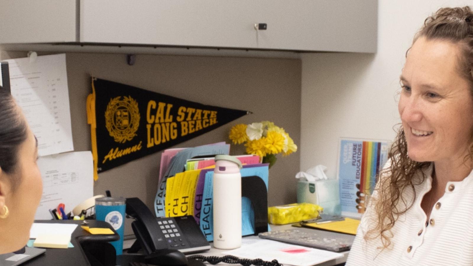 An advisor speaks to a student in the Student Success and Advising Center