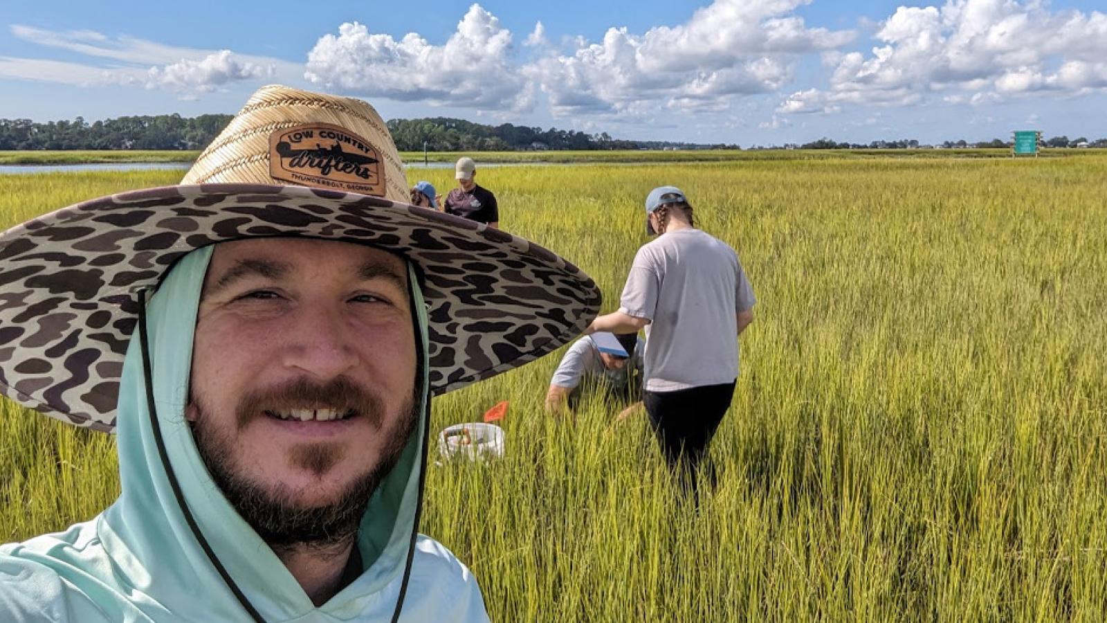 John Carroll in a field
