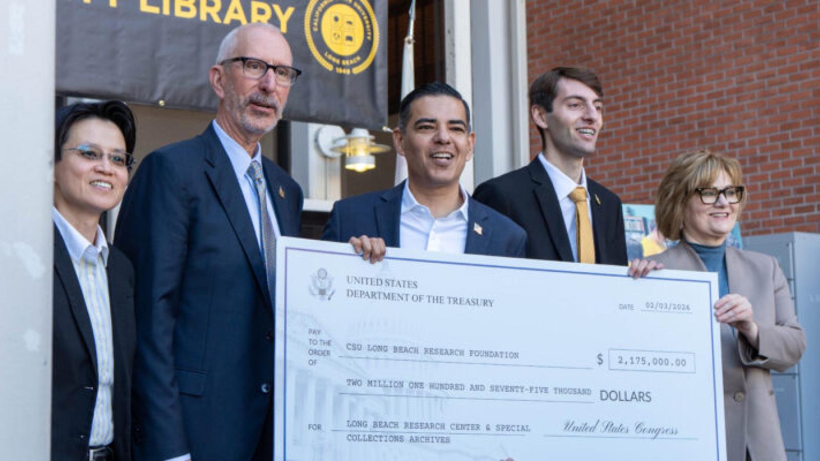 Rep. Robert Garcia presenting check