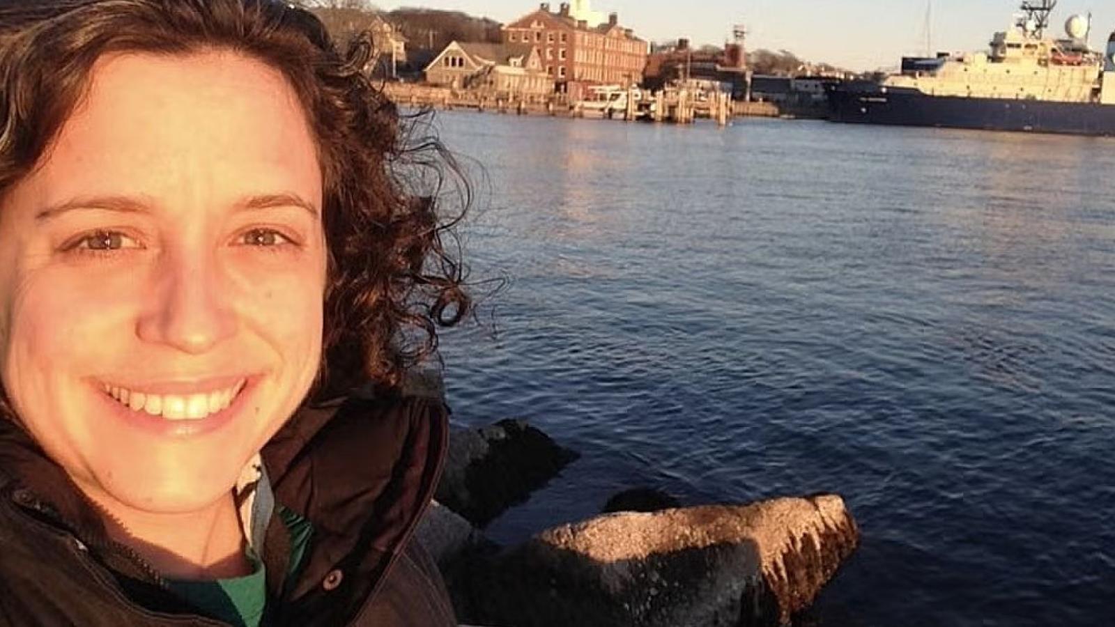 Rebecca Helm near a body of water