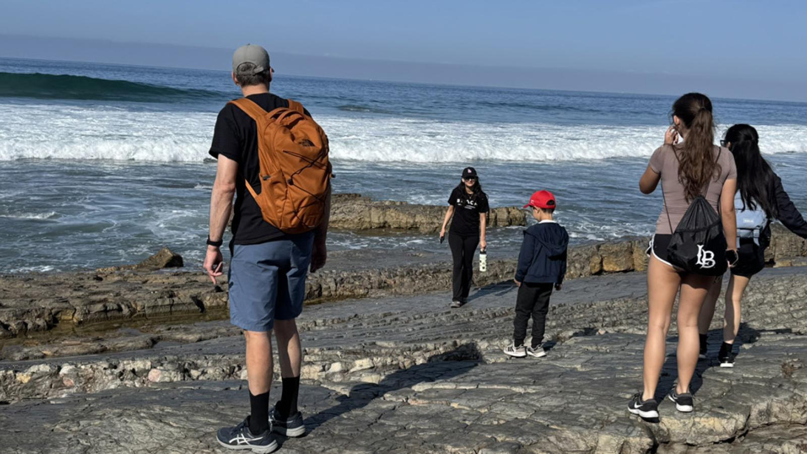 students and mentors exploring tidal pool