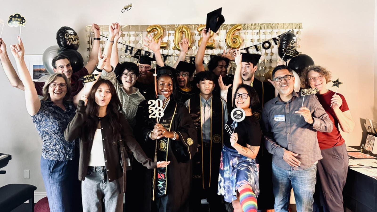 graduates, mentors, friends, and family at the celebration