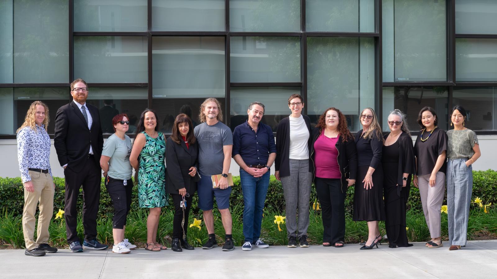 group of people standing in front of building