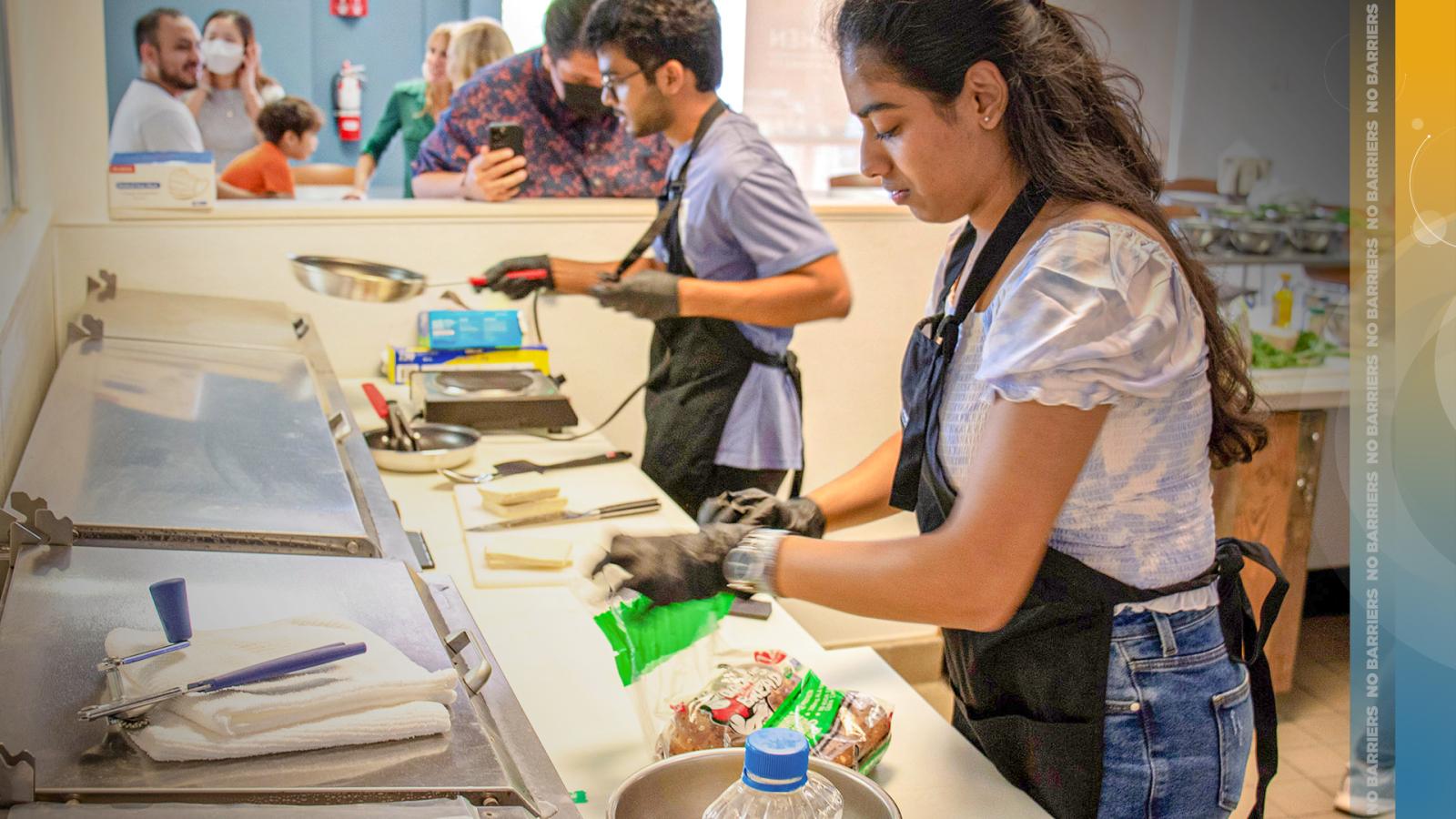Students prepare food in Beach Kitchen