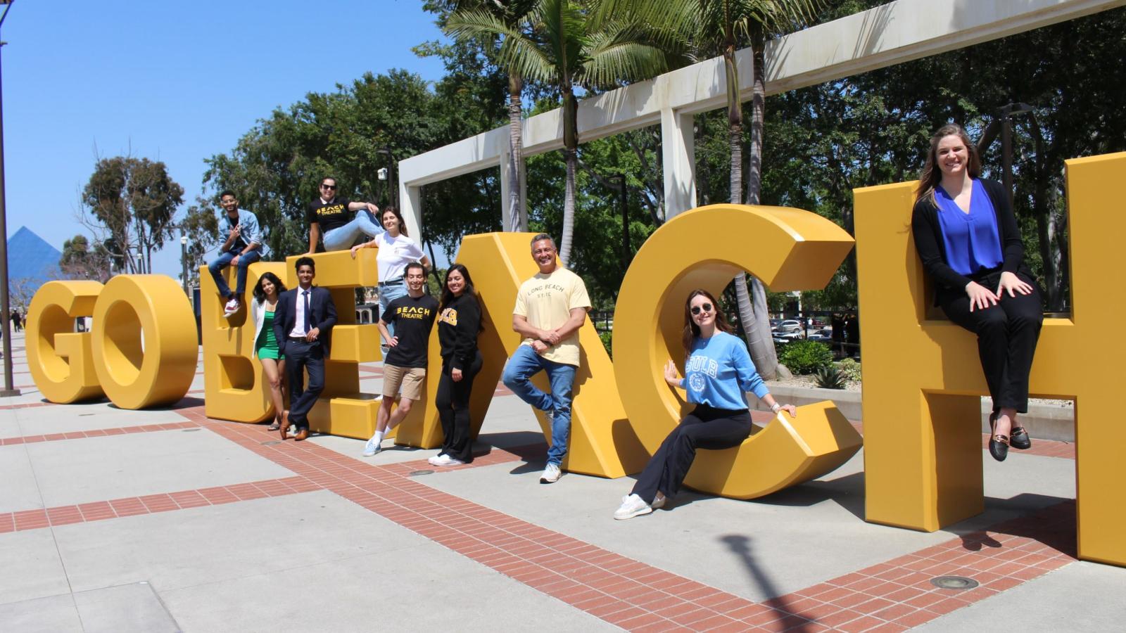 picture of students in front of the Go Beach sign at CSULB