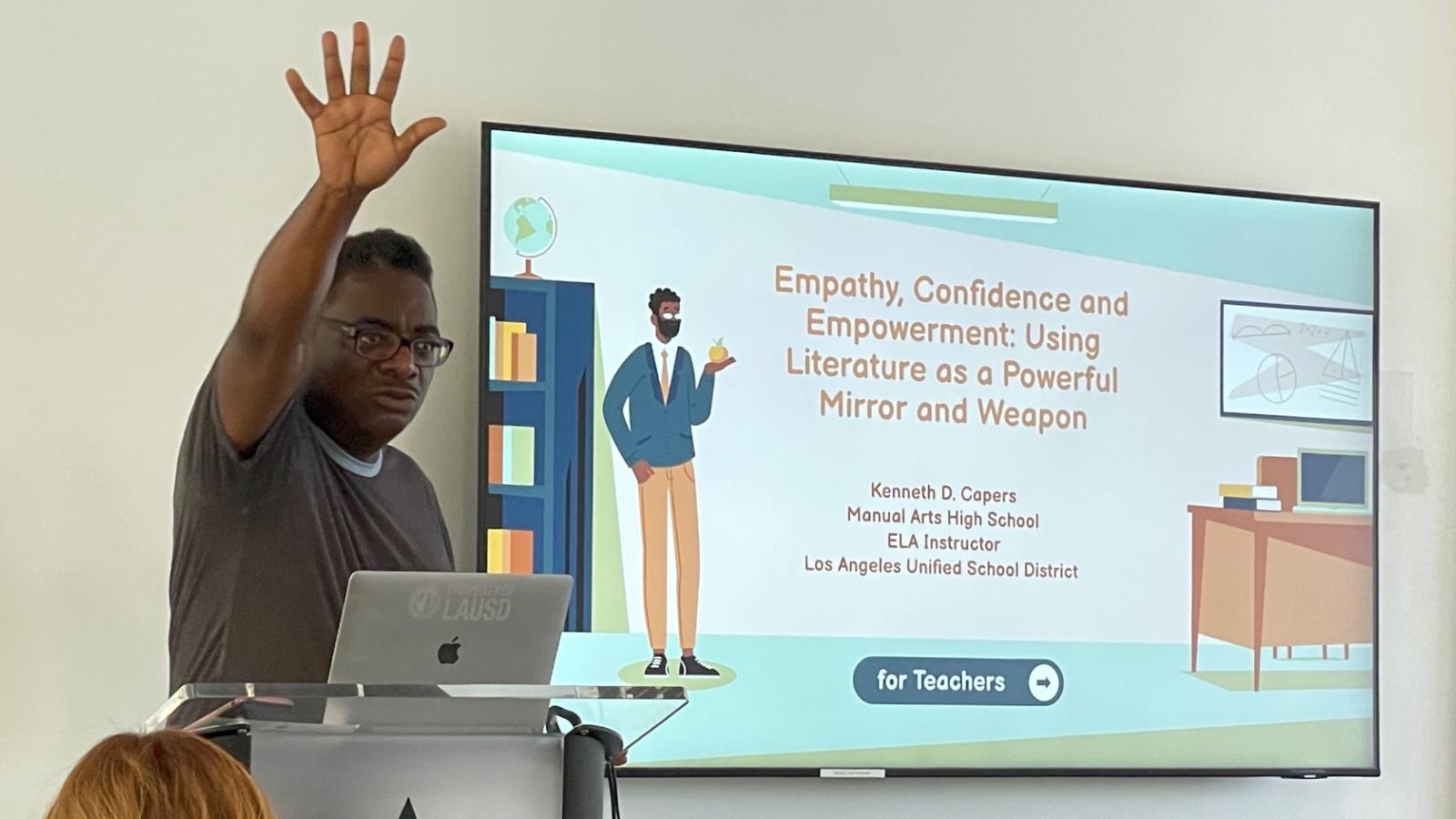 Kenneth Capers speaks in front of a classroom of teachers