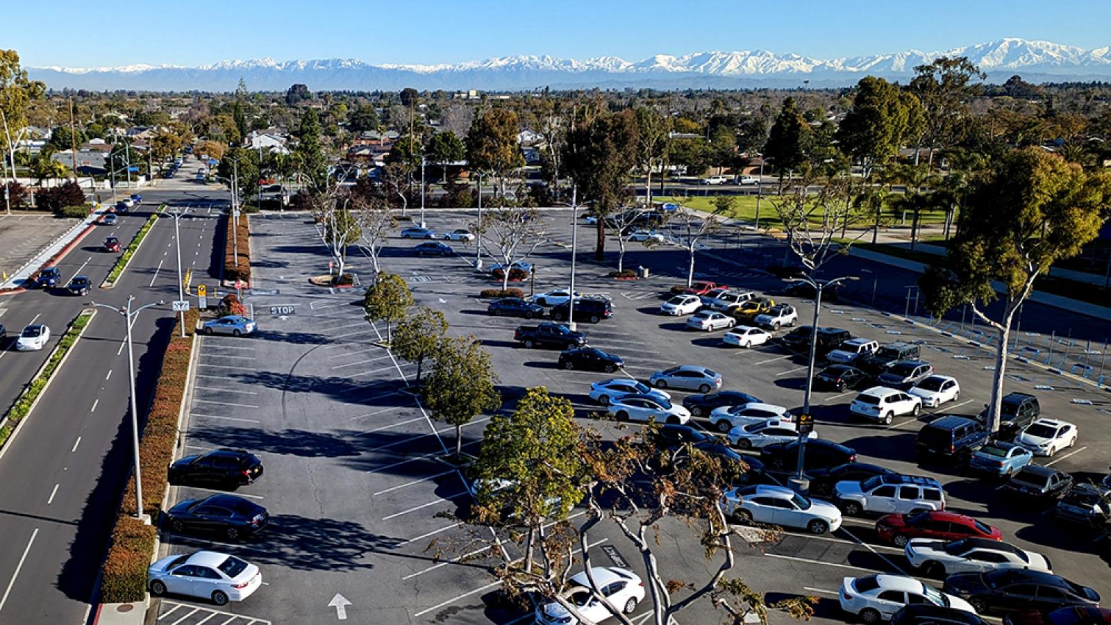 Parking lot with snowy mountains in the distance