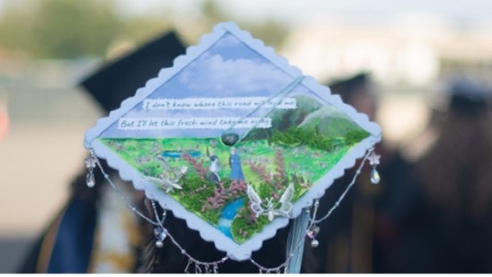 Close up of grad cap among group of college graduates at commencement
