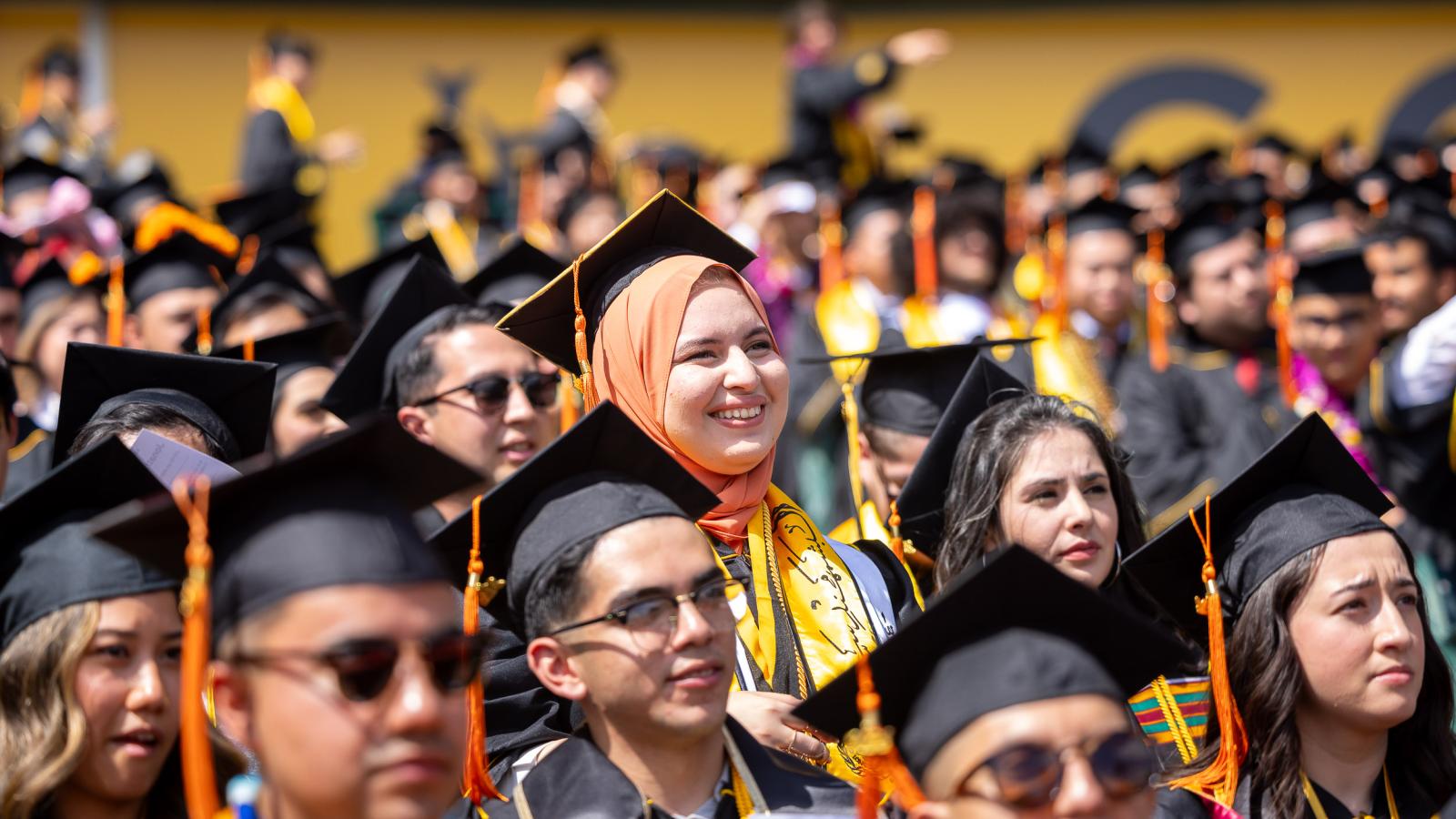 A diverse crowd of graduates at Commencement