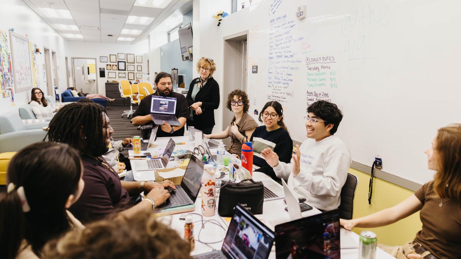 A newsroom meeting at the LB Current