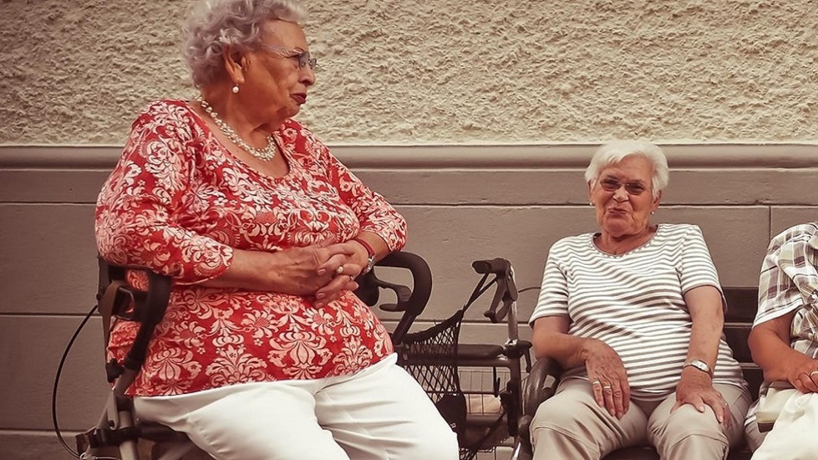 Elderly ladies having a conversation in the evening