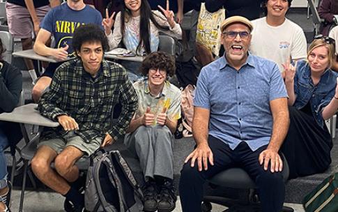Animation winners with professor in a classroom
