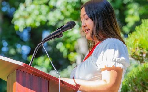 Student speaking at podium