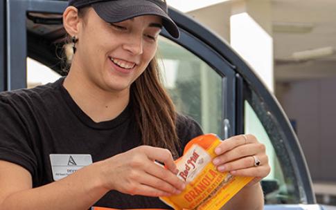 Student holds package of oatmeal