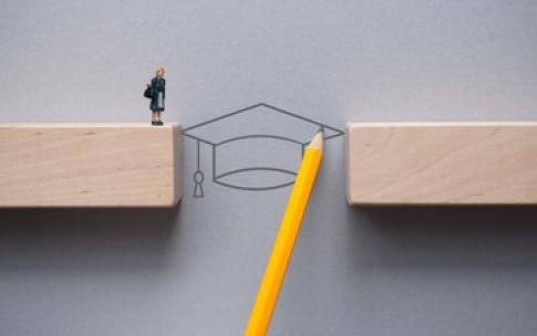 person graphic walking over graduation cap