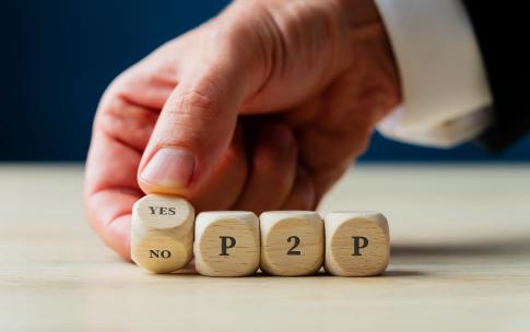 Hand  placing YES/NO Peer 2 Peer dice
