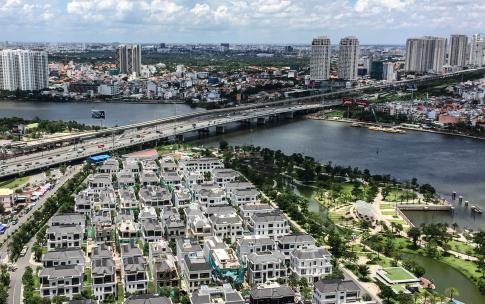 large city with bridges very dense houses a river crossing
