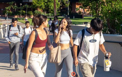 Students moving along a campus walkway