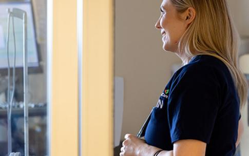 RN Kirsten Shumaker checks on a patient