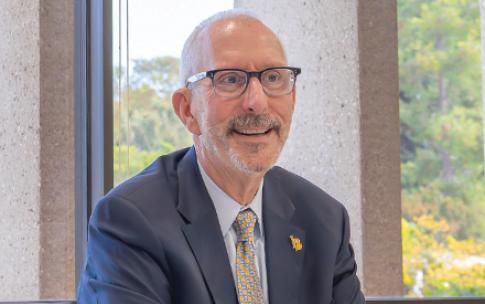 CSULB President Andrew Jones '82 seated at a table