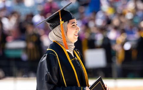 A CSULB graduate wearing a hijab