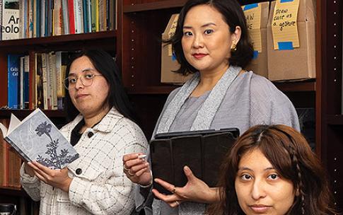 Two students and a professor (middle) at the Genre conference room at CSULB