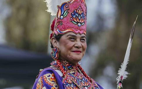 A woman wearing Indigenous regalia at the 2026 CSULB Pow Wow