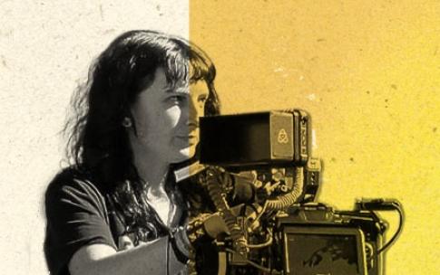 Person operates a video camera on a tripod