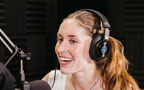 CSULB student journalist in a podcasting studio
