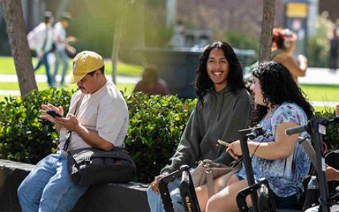 Students sitting and chatting, scooters in front of them