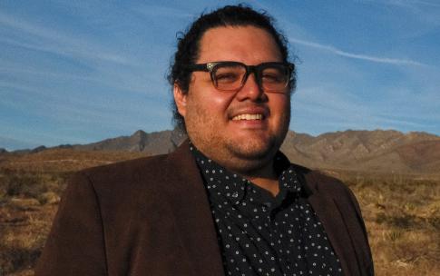 Dr. Roger Renteria in front of desert landscape