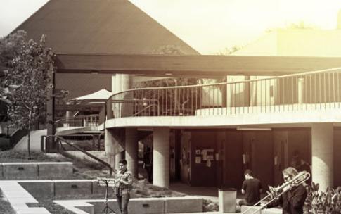 A student plays a trombone near the Bob Cole center.
