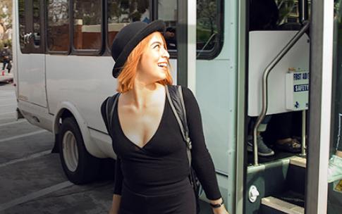 student getting off shuttle