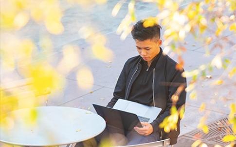 Student with laptop - Closing the Digital Divide