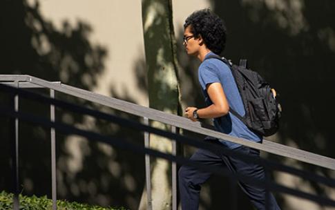 Student walking up stairs