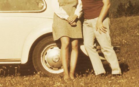 alumni couple near car