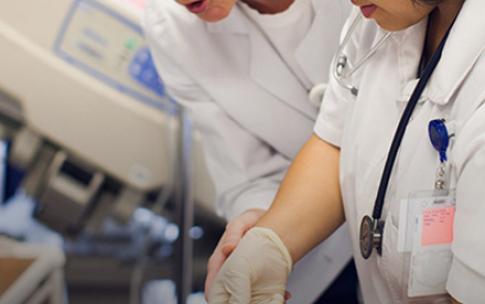 student nurse administer shot
