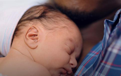 Father holding baby