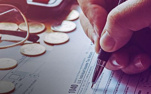 person filling out tax return