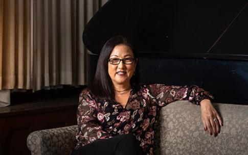 Donor Izumi Hara sitting on sofa