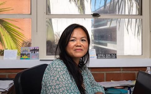 Professor Sophia Seng sitting at her desk