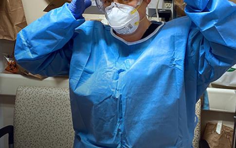 Healthcare hero Cherene puts on head covering
