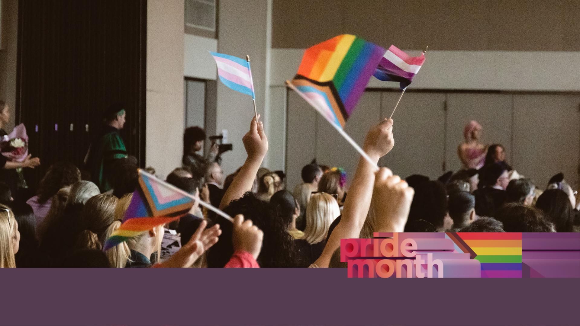 Student waving pride flags