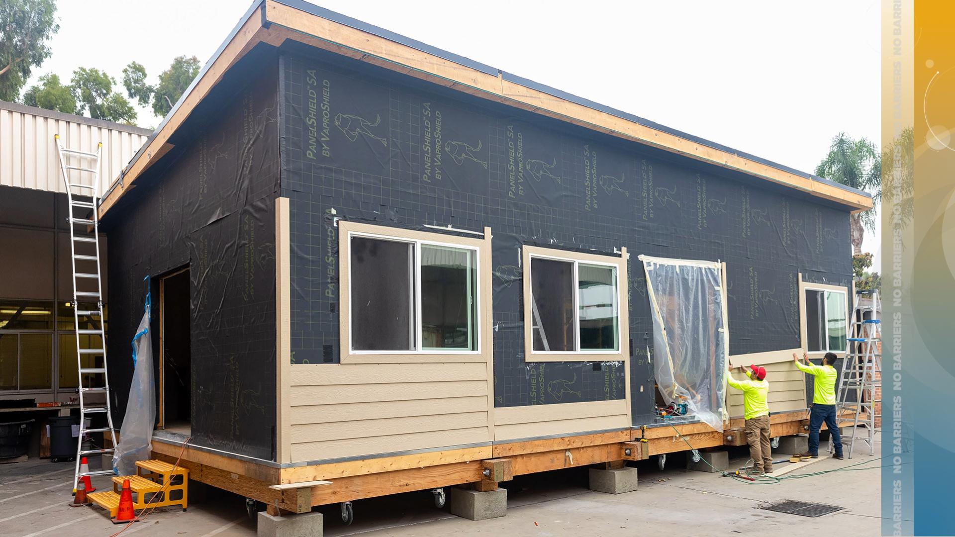Workers building tiny house