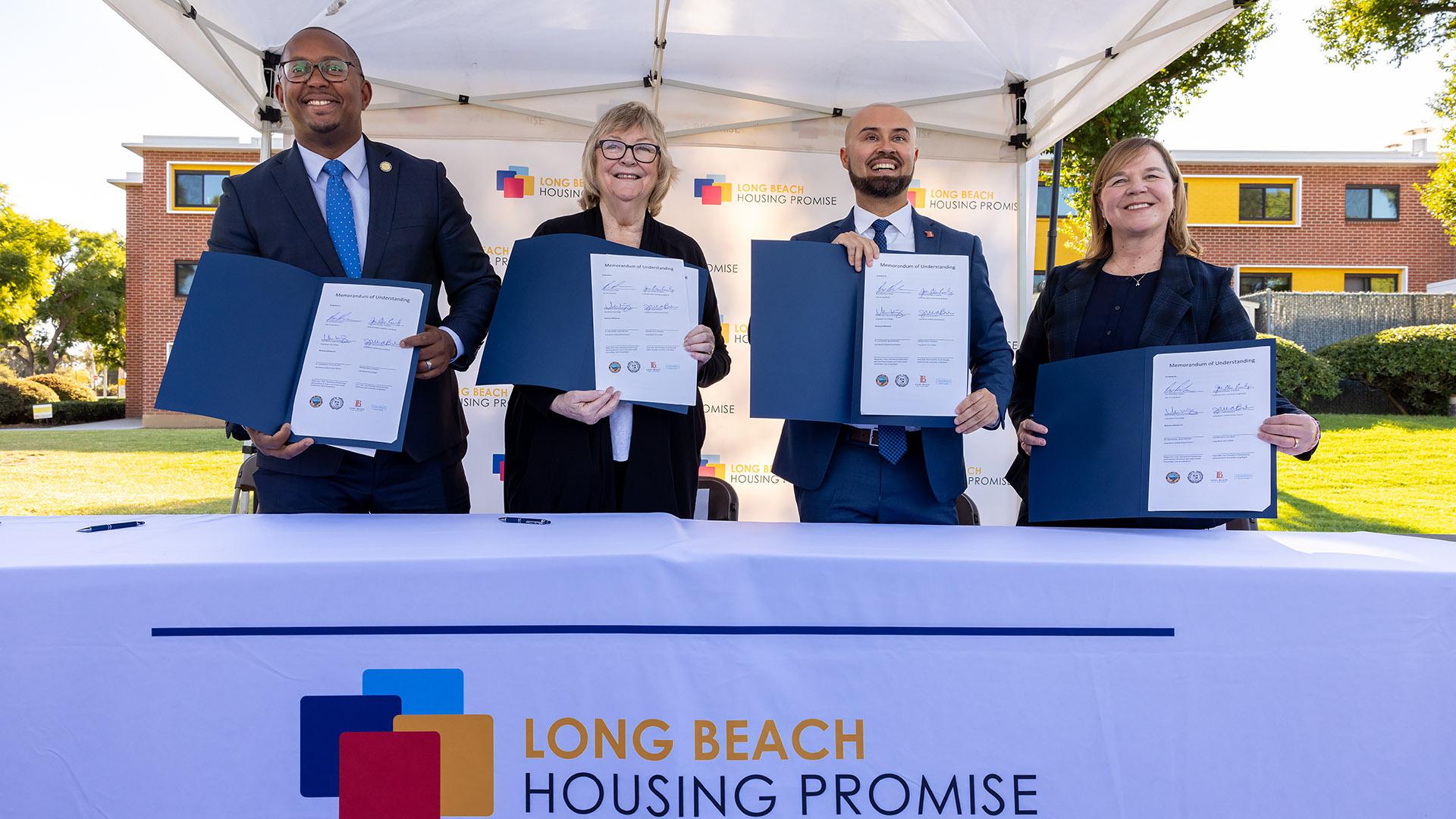 Officials hold signed memorandum for Long Beach Housing Promise