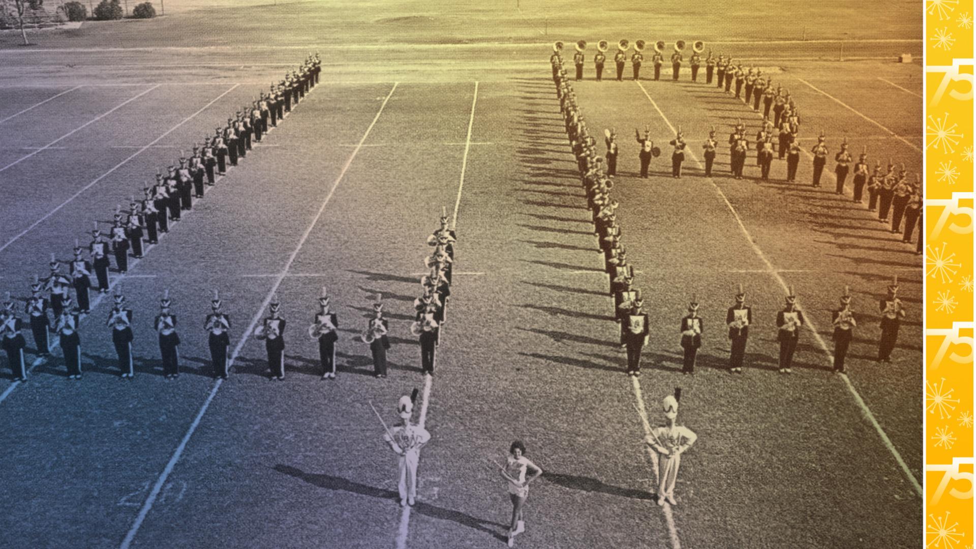 Marching band members in an "LB" formation on a football field