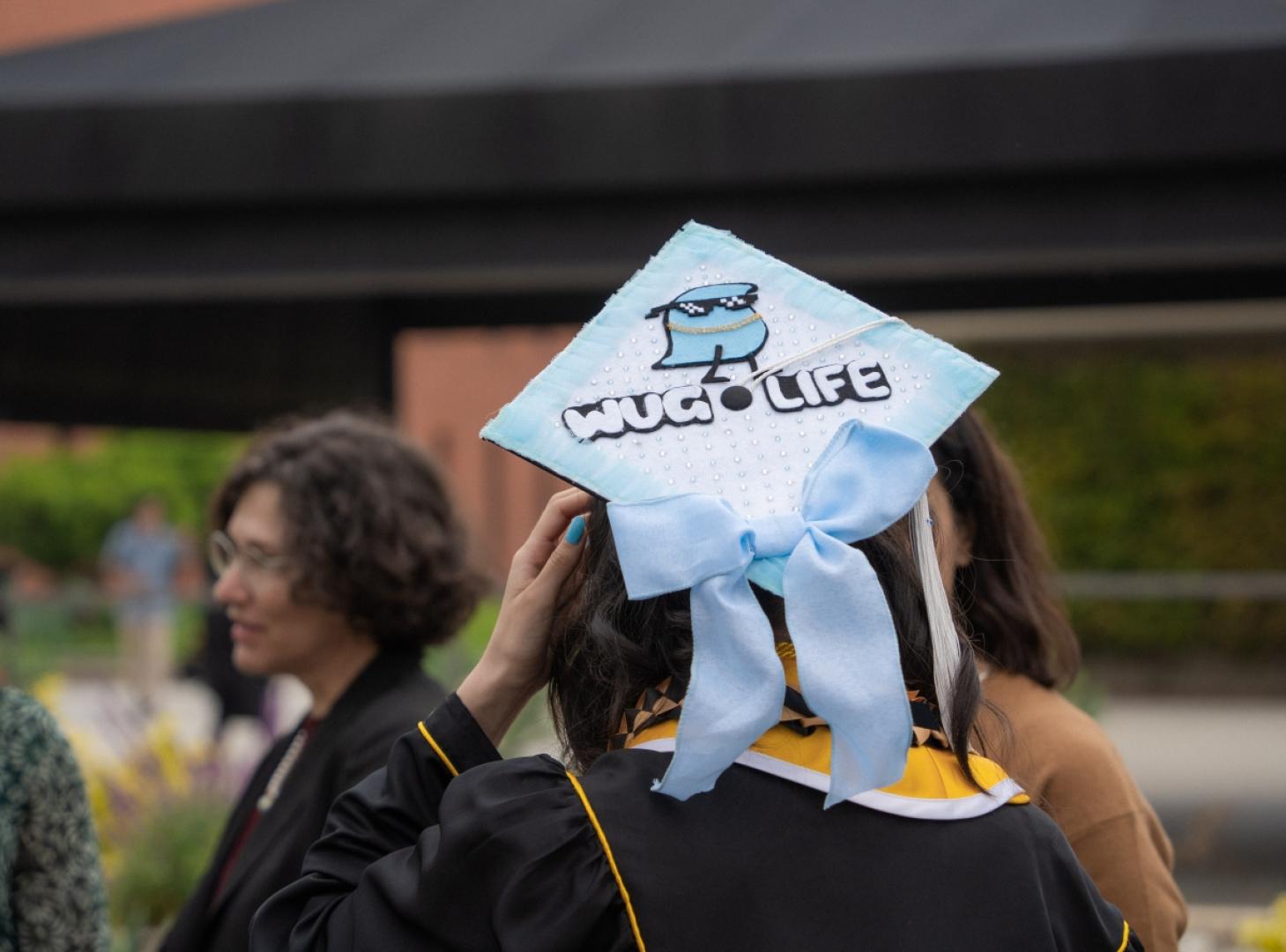 Grad cap with "Wug Life" design.