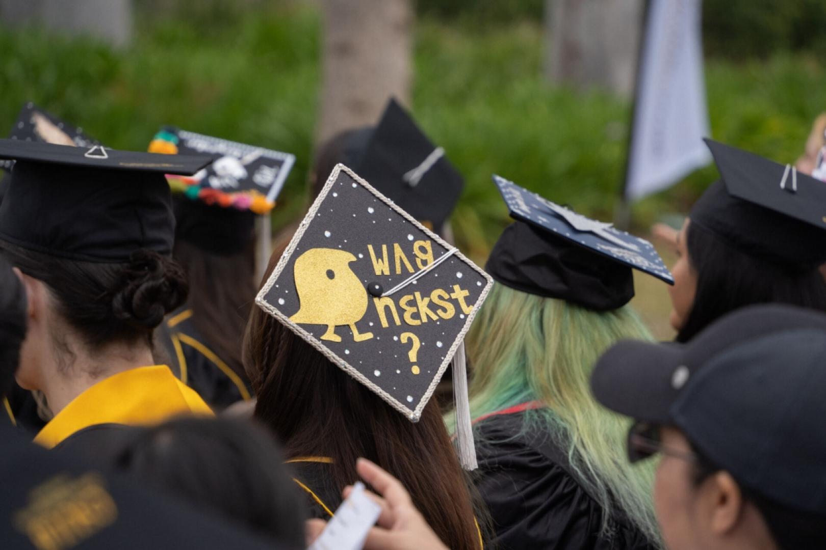 Graduation cap designed with "Wug Next?" transcribed in IPA